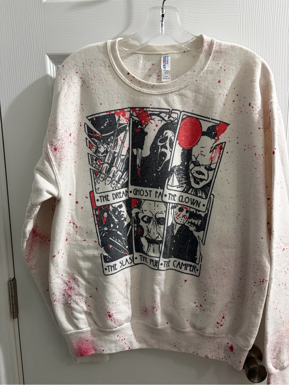 Jerzees Cream Crewneck Sweatshirt with Black Horror Graphic and Red Splatter